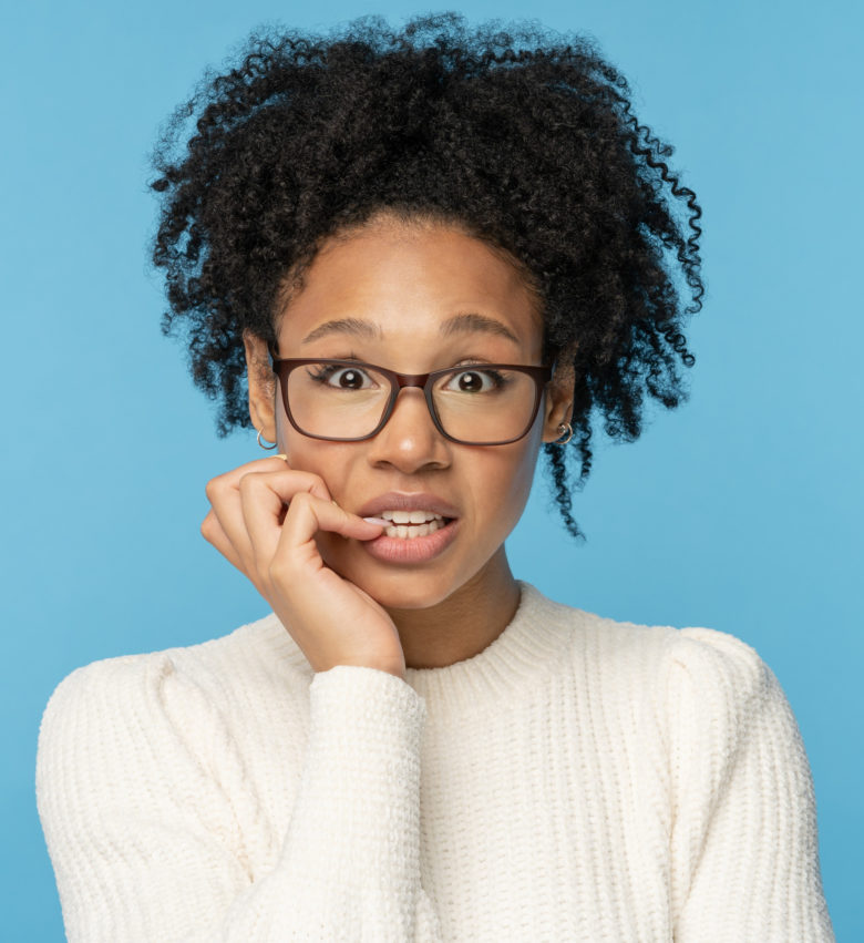 woman looking worried about seeing a periodontist